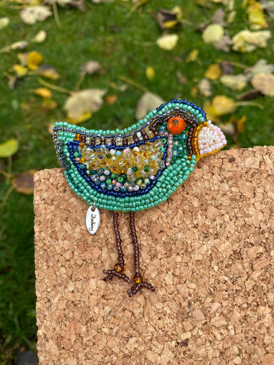 Fly baby bird brooch